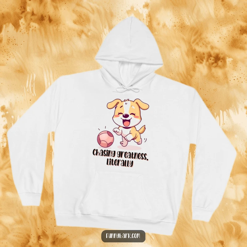Funny dog passionately barking while chasing a red ball, printed on a soft, cozy hoodie.