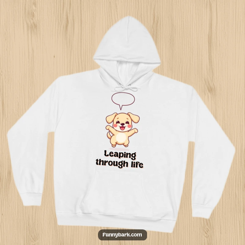 Funny and cozy hoodie featuring a small dog with floppy ears joyfully leaping, a speech bubble adding a whimsical touch.